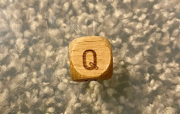 (1) Wooden "Q" Bead